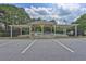 Sheltered seating area at the tennis courts, offering a comfortable space to rest and watch the game at 145 Millennial Ct, Lawrenceville, GA 30045