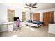 Bright bedroom with a study area, two closets, and windows that let in plenty of natural light at 2889 Carrousel Ct, Stone Mountain, GA 30087