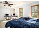 Sunlit bedroom with windows providing ample natural light and an adjacent study area at 2889 Carrousel Ct, Stone Mountain, GA 30087