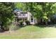 Traditional home with well-maintained lawn and mature trees at 2889 Carrousel Ct, Stone Mountain, GA 30087