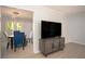 Living room with view to dining room and modern entertainment center at 2889 Carrousel Ct, Stone Mountain, GA 30087