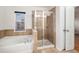 Bathroom featuring a tub, stand alone shower, and tile flooring at 5621 Cobblestone Creek Ave # 14, Mableton, GA 30126