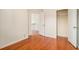 This empty bedroom features hardwood floors and a closet at 5621 Cobblestone Creek Ave # 14, Mableton, GA 30126