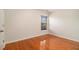 Bedroom with hardwood floors, a window, and access door at 5621 Cobblestone Creek Ave # 14, Mableton, GA 30126