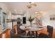 Modern kitchen with white cabinetry, stainless steel appliances, and dining area at 5621 Cobblestone Creek Ave # 14, Mableton, GA 30126