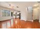 Open-concept living space featuring hardwood floors, bright windows, and staircase at 5621 Cobblestone Creek Ave # 14, Mableton, GA 30126