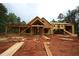 Exterior view of a two-story home under construction, featuring wood framing and a covered porch at 578 Price Rd, Carrollton, GA 30116