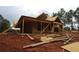 Exterior view of a two-story home under construction, featuring wood framing and an incomplete lawn at 578 Price Rd, Carrollton, GA 30116