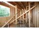 An interior view of the new home under construction shows the wood frame and plumbing at 578 Price Rd, Carrollton, GA 30116
