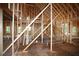 An interior view of the new home under construction showing the wood frame and floor at 578 Price Rd, Carrollton, GA 30116