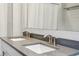 Close up on a bathroom with a double sink vanity featuring modern fixtures at 1174 City Park Ln, Decatur, GA 30033