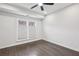 Clean bedroom featuring hardwood floors, neutral paint, and natural light from a double window at 1174 City Park Ln, Decatur, GA 30033