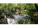 Scenic view of South Peachtree Creek showing flowing water, rocks, and sunlight, great for nature walks at 1174 City Park Ln, Decatur, GA 30033