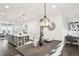 Open concept dining room with statement lighting, and modern decor at 1174 City Park Ln, Decatur, GA 30033