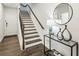 Lovely entryway with hardwood floors, staircase, and stylish decor at 1174 City Park Ln, Decatur, GA 30033