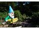 Garden gnome welcomes you into the natural surroundings of Medlock Park with the garden area in the background at 1174 City Park Ln, Decatur, GA 30033
