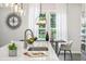 Bright kitchen featuring stainless appliances, white countertops, and modern lighting at 1174 City Park Ln, Decatur, GA 30033