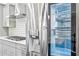 Stainless steel refrigerator with water dispenser in a modern kitchen with white subway tile and countertops at 1174 City Park Ln, Decatur, GA 30033