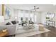 Bright living room with large windows, modern furnishings, ceiling fan, and stylish decor at 1174 City Park Ln, Decatur, GA 30033