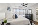 Bright main bedroom featuring a king bed, luxurious linens, and view of the ensuite bathroom at 1174 City Park Ln, Decatur, GA 30033