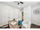 Office space featuring a desk, chairs, a ceiling fan, and hardwood floors at 1174 City Park Ln, Decatur, GA 30033