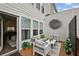 Cozy outdoor patio with comfortable seating, stylish decor, and a glimpse of the interior through sliding glass doors at 1174 City Park Ln, Decatur, GA 30033