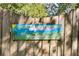 Medlock Park Garden sign with an image of a garden featuring sheep, trees, and flowers in a sunny landscape at 1174 City Park Ln, Decatur, GA 30033