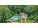 Aerial view of the community pool surrounded by trees and lounge chairs at 1174 City Park Ln, Decatur, GA 30033