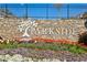 Community sign with stone base and flower beds at 1174 City Park Ln, Decatur, GA 30033