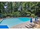 Enjoy the community swimming pool with lounge chairs and umbrellas for relaxing summer days at 1174 City Park Ln, Decatur, GA 30033