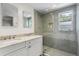 Modern bathroom with double vanity, marble countertops, and a spacious glass-enclosed shower at 2180 Howell Mill Nw Rd, Atlanta, GA 30318