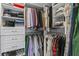 Organized walk-in closet featuring custom shelving and hanging rods for ample storage space at 2180 Howell Mill Nw Rd, Atlanta, GA 30318