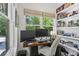 Bright office space featuring a wooden desk with two monitors and custom built-in shelving at 2180 Howell Mill Nw Rd, Atlanta, GA 30318