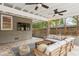 Inviting porch features comfortable seating, mounted TV and a ceiling fan to provide outdoor relaxation at 2180 Howell Mill Nw Rd, Atlanta, GA 30318