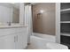 Modern bathroom with tiled shower, sleek vanity, and built-in shelving at 2445 Kings Point Dr, Dunwoody, GA 30338