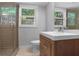Bathroom featuring a glass enclosed shower, modern vanity, and tiled floors at 2445 Kings Point Dr, Dunwoody, GA 30338