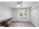 Bedroom featuring wood floors, a large window with white curtains, and a double door closet at 2445 Kings Point Dr, Dunwoody, GA 30338