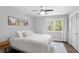 Comfortable bedroom featuring a plush bed, artwork, and ample natural light at 2445 Kings Point Dr, Dunwoody, GA 30338