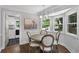 Charming breakfast nook with natural light, a cozy table, and easy access to laundry and kitchen spaces at 2445 Kings Point Dr, Dunwoody, GA 30338