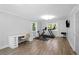 Spacious home gym with exercise equipment, desk space, and wood-style flooring at 2445 Kings Point Dr, Dunwoody, GA 30338