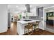 Modern kitchen with white cabinets, stainless steel appliances, and marble countertops, perfect for culinary enthusiasts at 2445 Kings Point Dr, Dunwoody, GA 30338