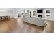 Spacious living area with wood floors, fireplace, and seamlessly connects to a modern kitchen and dining area at 2445 Kings Point Dr, Dunwoody, GA 30338