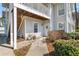 Charming condo entrance with a decorative door and landscaped pathway, creating a welcoming approach at 303 Gettysburg Pl, Atlanta, GA 30350