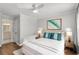 Serene main bedroom with hardwood floors, stylish decor, and great light offers a tranquil retreat for rest and relaxation at 303 Gettysburg Pl, Atlanta, GA 30350