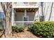 Relaxing porch area with windchimes, perfect for enjoying the outdoors in a cozy setting at 303 Gettysburg Pl, Atlanta, GA 30350
