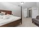 Spacious bedroom featuring neutral carpeting, and multiple closets for storage at 3234 Baymount Way, Lawrenceville, GA 30043