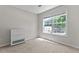 Bright bedroom with a neutral color scheme, plush carpet, and natural light at 3234 Baymount Way, Lawrenceville, GA 30043