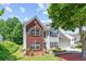 Charming two-story home with a brick facade, manicured landscaping, and a well-maintained lawn at 3234 Baymount Way, Lawrenceville, GA 30043