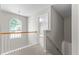 Upstairs hallway with carpet and arched window at 3234 Baymount Way, Lawrenceville, GA 30043