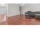 Spacious living room featuring hardwood floors, neutral paint, and abundant natural light at 3234 Baymount Way, Lawrenceville, GA 30043